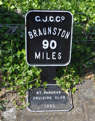 Black and white metal sign - Braunston 90 miles
